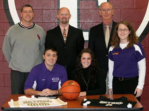 Ginny St. Lawrence (center seated) signs with the Lady Wildcats for the 2008-2009 season.